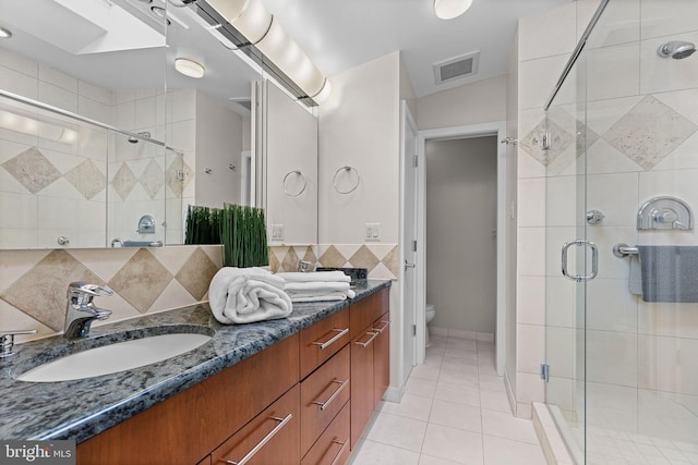 3440 Mansfield Rd, Falls Church, VA 22041 - bathroom with toilet, a stall shower, tile patterned floors, and double vanity