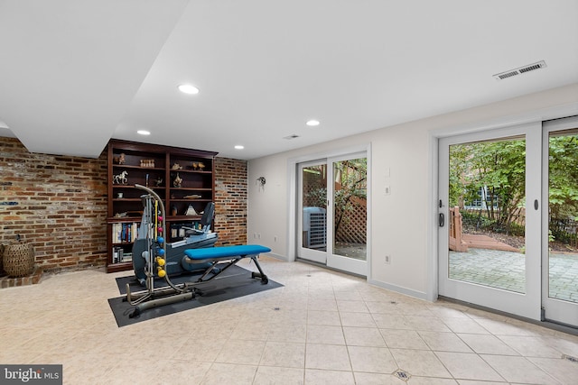 3440 Mansfield Rd, Falls Church, VA 22041 - workout area featuring recessed lighting, brick wall, baseboards, and tile patterned flooring