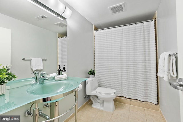 3440 Mansfield Rd, Falls Church, VA 22041 - full bathroom featuring baseboards, toilet, tile patterned floors, a sink, and a shower with shower curtain