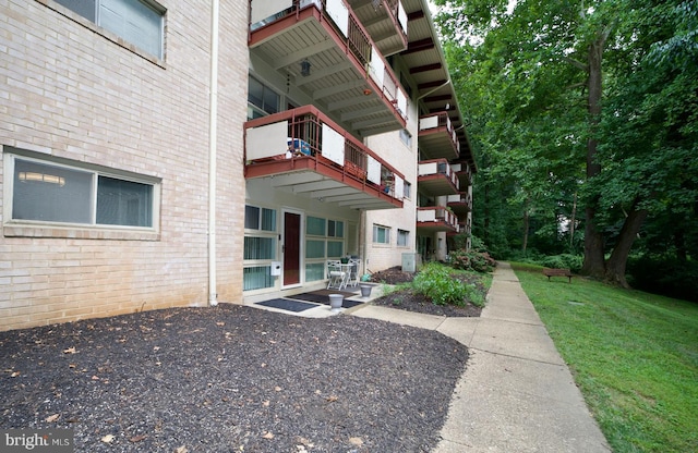 4225 Americana Dr Unit 4225A, Annandale, VA 22003 - exterior space featuring a yard and brick siding