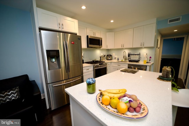 4225 Americana Dr Unit 4225A, Annandale, VA 22003 - kitchen with appliances with stainless steel finishes, a sink, dark wood finished floors, white cabinetry, and recessed lighting