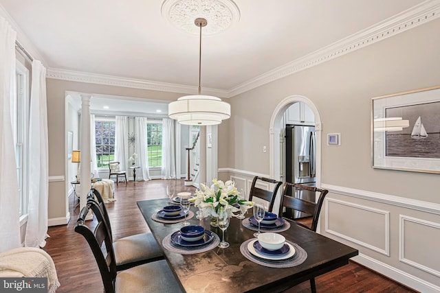 7098 Garden Walk, Columbia, MD 21044 - dining area featuring ornamental molding, dark wood finished floors, a wainscoted wall, and ornate columns