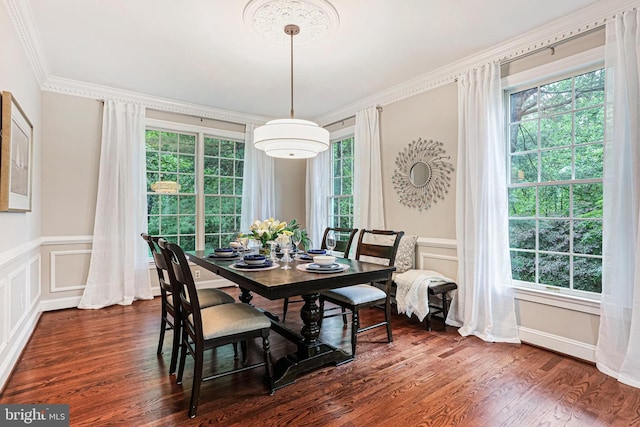 7098 Garden Walk, Columbia, MD 21044 - dining room with a decorative wall, dark wood-style flooring, crown molding, and a wainscoted wall