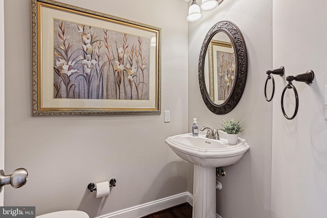 7098 Garden Walk, Columbia, MD 21044 - bathroom featuring toilet, baseboards, and wood finished floors