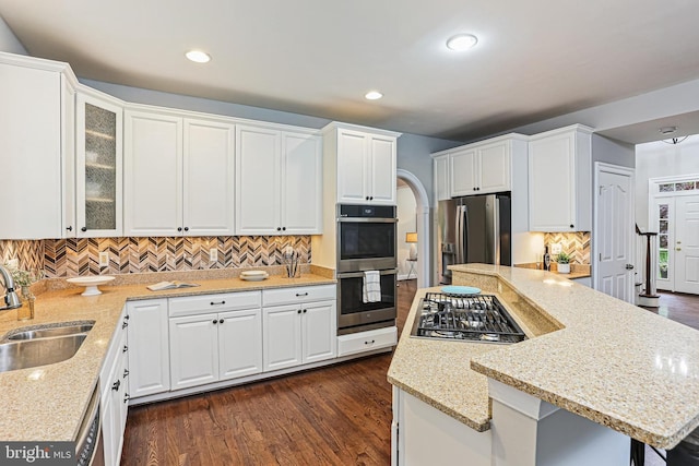 7098 Garden Walk, Columbia, MD 21044 - kitchen featuring stainless steel appliances, a sink, white cabinetry, a kitchen island, and recessed lighting