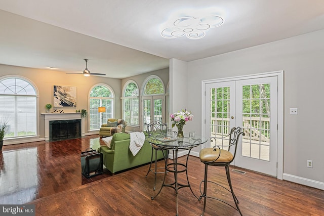7098 Garden Walk, Columbia, MD 21044 - dining room with healthy amount of natural light, a fireplace, and wood finished floors