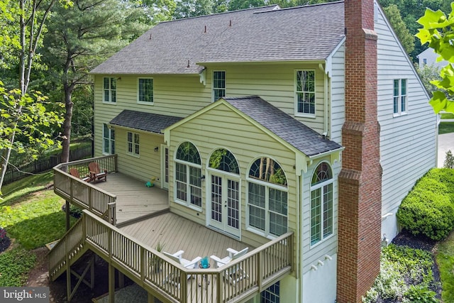 7098 Garden Walk, Columbia, MD 21044 - back of house with a chimney, a shingled roof, and a wooden deck