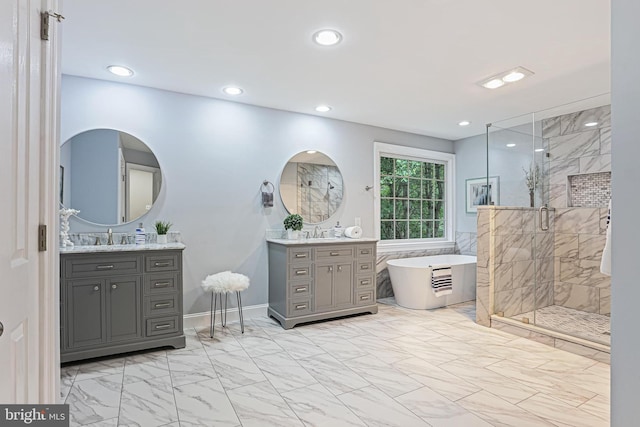 7098 Garden Walk, Columbia, MD 21044 - full bath featuring marble finish floors, a stall shower, a freestanding tub, two vanities, and recessed lighting