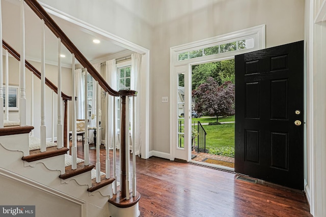 7098 Garden Walk, Columbia, MD 21044 - foyer featuring stairs, wood finished floors, baseboards, and crown molding
