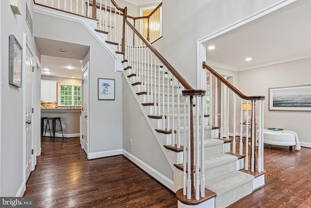 7098 Garden Walk, Columbia, MD 21044 - stairway with wood finished floors, ornamental molding, baseboards, recessed lighting, and a towering ceiling