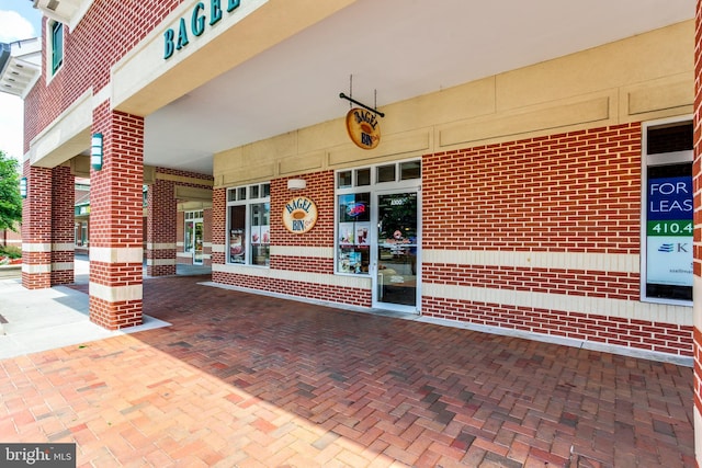 7098 Garden Walk, Columbia, MD 21044 - doorway to property featuring brick siding