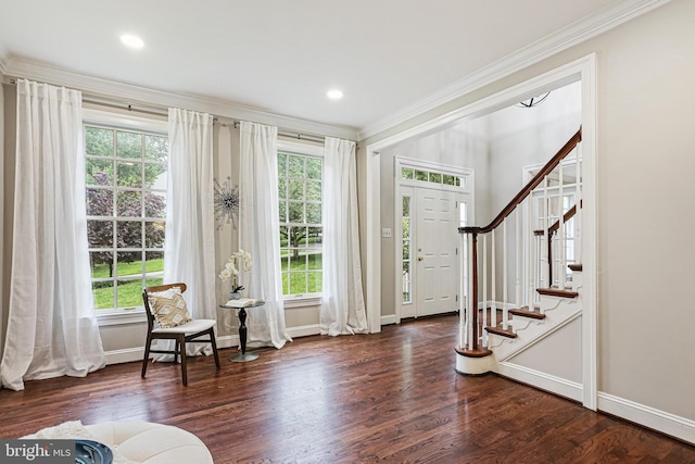 7098 Garden Walk, Columbia, MD 21044 - foyer with plenty of natural light, crown molding, baseboards, and wood finished floors