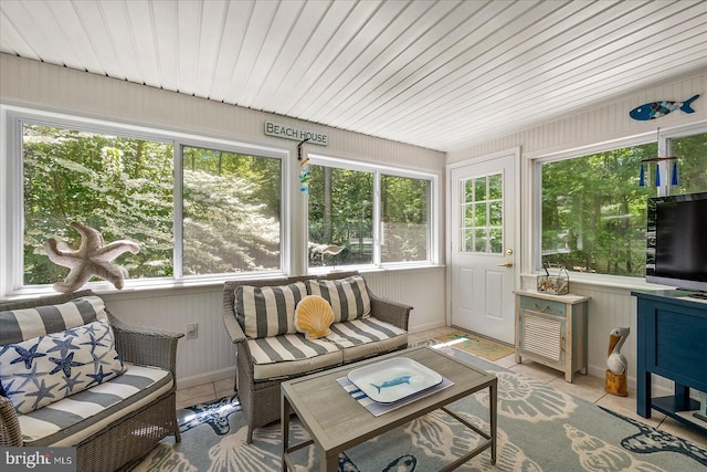 26 Capetown Rd, Ocean Pines, MD 21811 - sunroom featuring wooden walls, tile patterned flooring, plenty of natural light, and baseboards