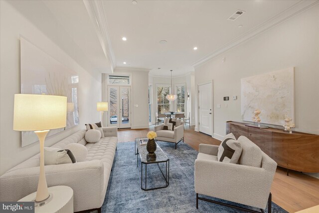 1335 11th St NW Unit 104, Washington, DC 20001 - living area featuring recessed lighting, wood finished floors, visible vents, and crown molding