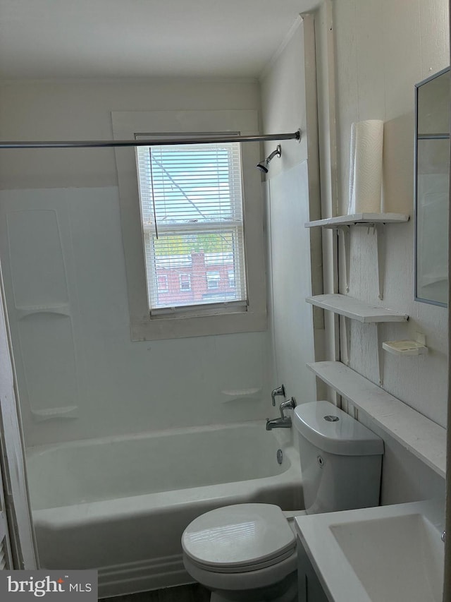 bathroom featuring shower / bathtub combination, toilet, and vanity