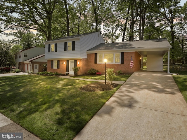 view of front of house with a carport, concrete driveway, a front yard, and brick siding