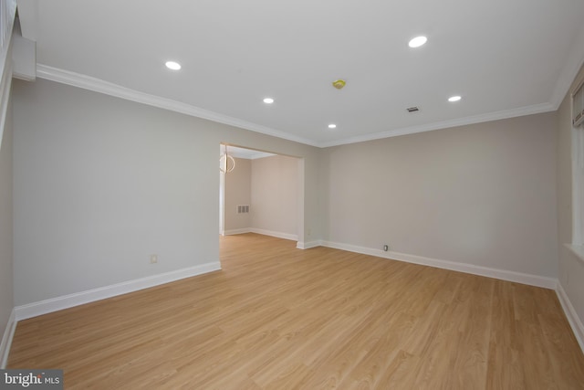 unfurnished room with baseboards, ornamental molding, light wood-style floors, and recessed lighting