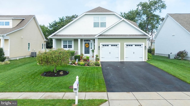 34795 Mute Swan Ln, Rehoboth Beach, DE 19971 - view of front facade featuring driveway, a front yard, cooling unit, and a garage