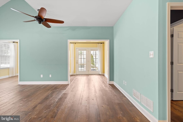34795 Mute Swan Ln, Rehoboth Beach, DE 19971 - empty room featuring hardwood / wood-style floors, vaulted ceiling, visible vents, a ceiling fan, and baseboards