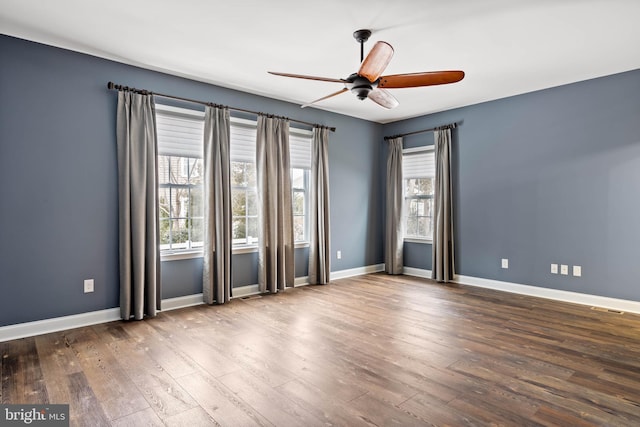 34795 Mute Swan Ln, Rehoboth Beach, DE 19971 - spare room with ceiling fan, a wealth of natural light, and wood finished floors
