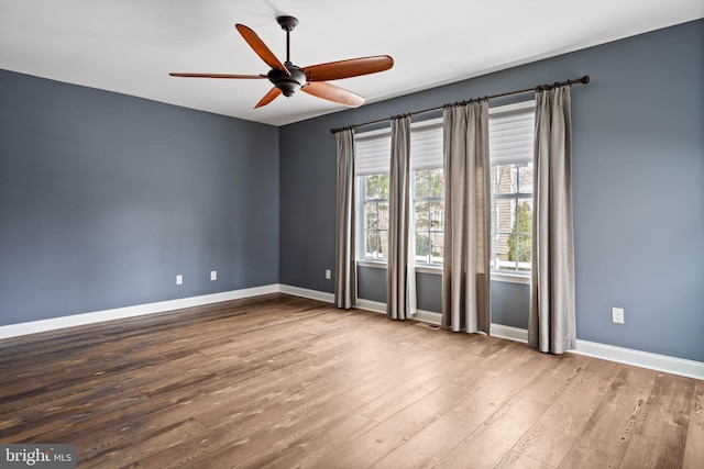 34795 Mute Swan Ln, Rehoboth Beach, DE 19971 - unfurnished room featuring baseboards, a ceiling fan, and wood finished floors