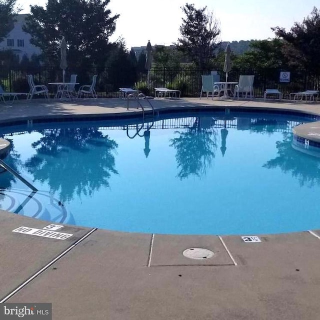 34795 Mute Swan Ln, Rehoboth Beach, DE 19971 - pool featuring a patio and fence