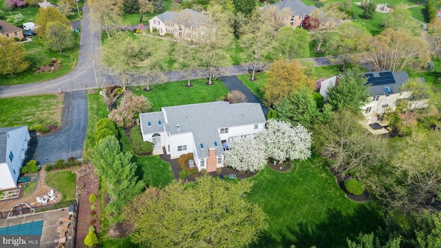 birds eye view of property with a residential view
