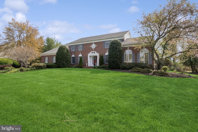 colonial home with a front yard