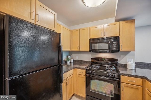 kitchen with light brown cabinets and black appliances