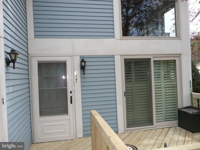 entrance to property with a wooden deck
