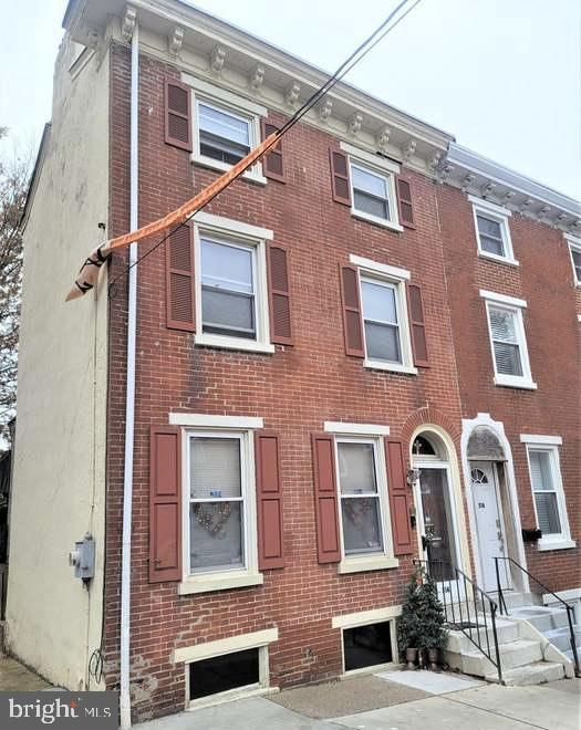 townhome / multi-family property with brick siding