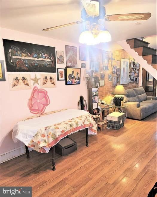 bedroom with wood finished floors