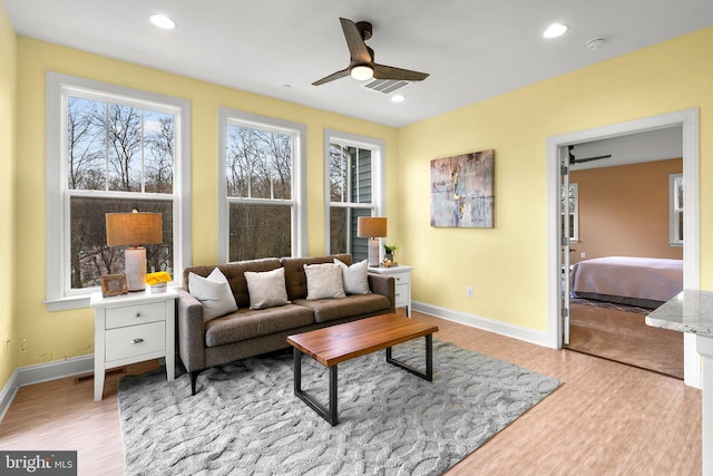 living room featuring recessed lighting, wood finished floors, baseboards, and ceiling fan