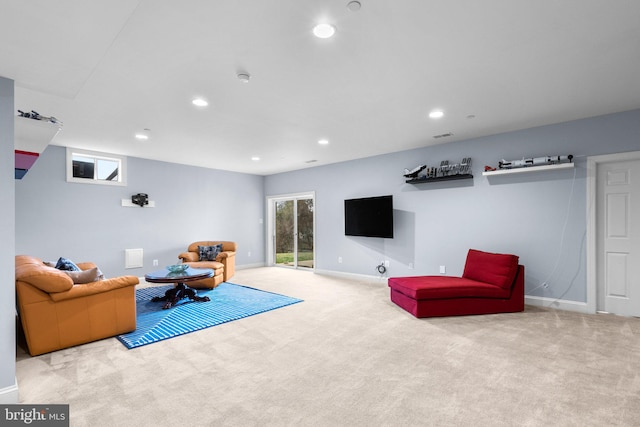 living room featuring recessed lighting, carpet floors, and baseboards