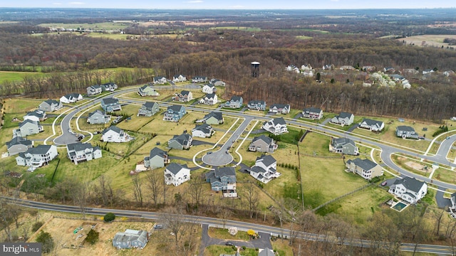 bird's eye view with a forest view and a residential view