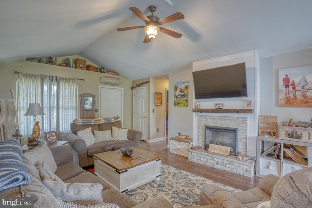 415 W High St, Felton, DE 19943 - living area with a fireplace, lofted ceiling, a ceiling fan, baseboards, and wood finished floors