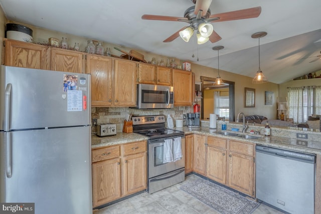 415 W High St, Felton, DE 19943 - kitchen featuring decorative backsplash, a sink, appliances with stainless steel finishes, vaulted ceiling, and a ceiling fan