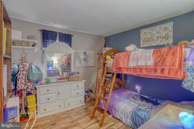 415 W High St, Felton, DE 19943 - bedroom with light wood-style flooring