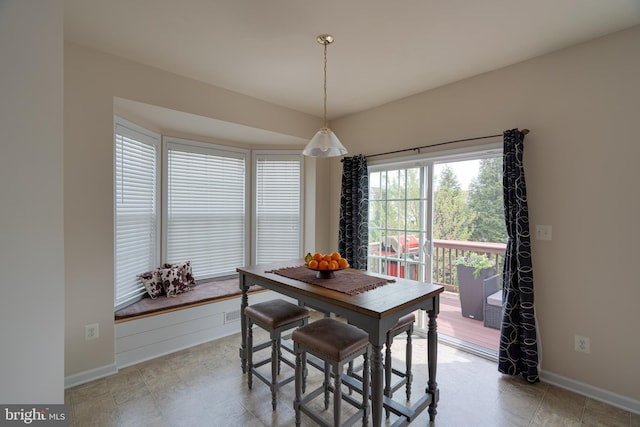 dining room featuring baseboards