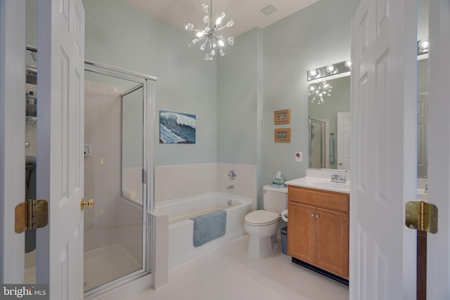 bathroom featuring an inviting chandelier, vanity, a stall shower, visible vents, and a garden tub