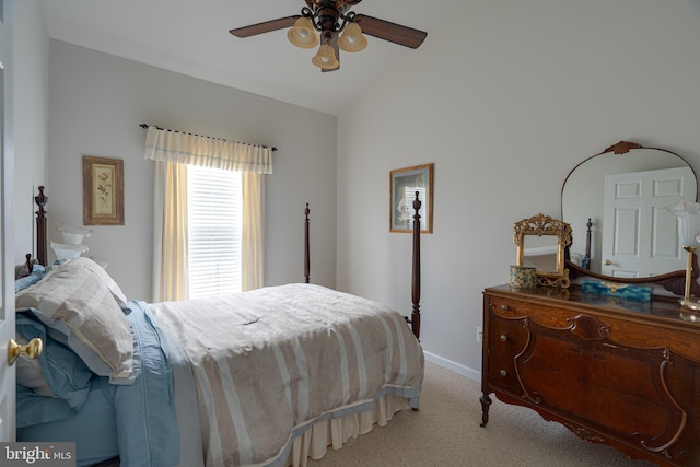 carpeted bedroom featuring ceiling fan, lofted ceiling, and baseboards