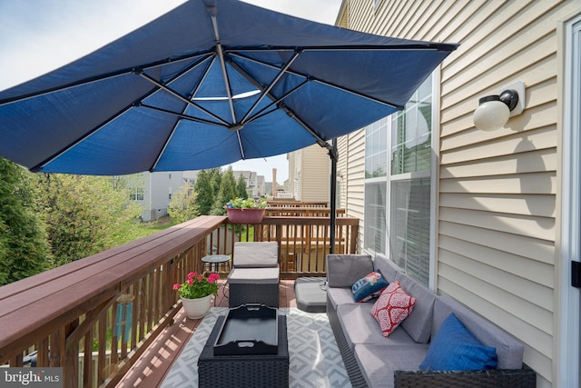 wooden deck with outdoor lounge area