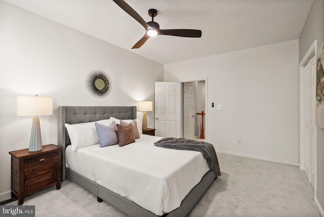 bedroom featuring a ceiling fan, baseboards, and light carpet