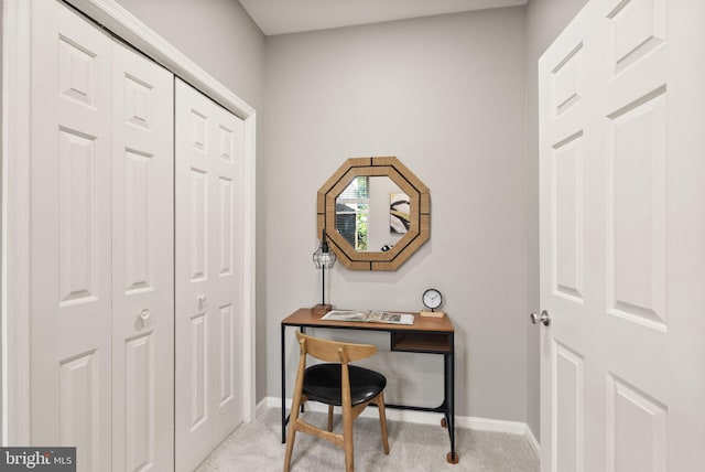 interior space with baseboards and carpet flooring