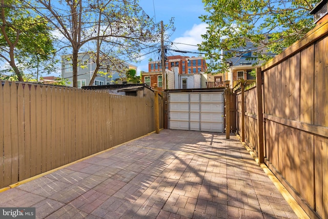 exterior space with fence and a garage
