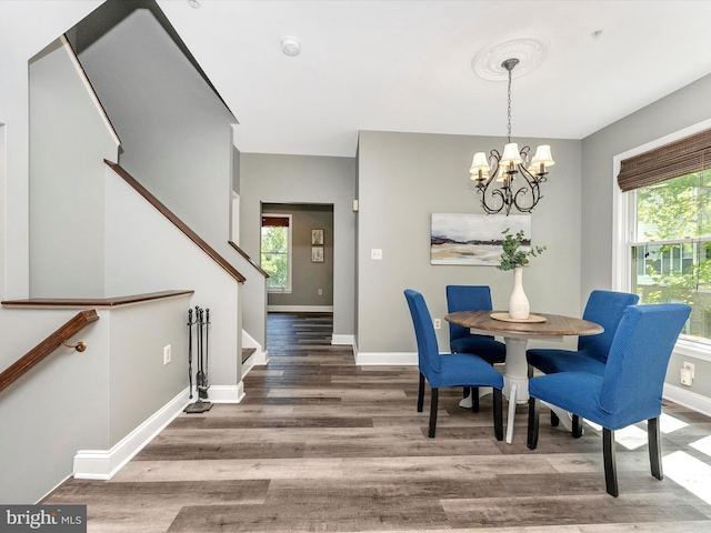 109 Rock Creek Ct, Frederick, MD 21702 - dining room featuring baseboards, wood finished floors, a notable chandelier, and stairs