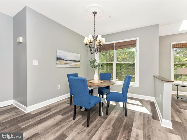 109 Rock Creek Ct, Frederick, MD 21702 - dining space with an inviting chandelier, wood finished floors, and baseboards