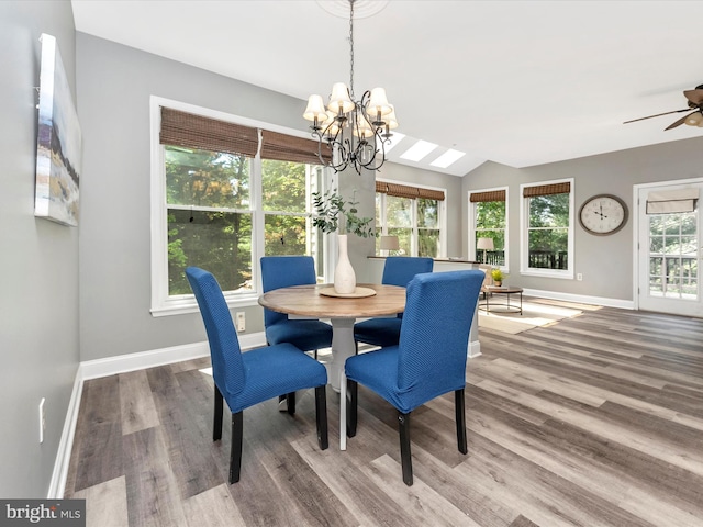 109 Rock Creek Ct, Frederick, MD 21702 - dining space featuring wood finished floors, ceiling fan with notable chandelier, vaulted ceiling, and baseboards