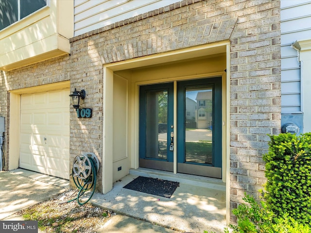 109 Rock Creek Ct, Frederick, MD 21702 - doorway to property featuring an attached garage and brick siding
