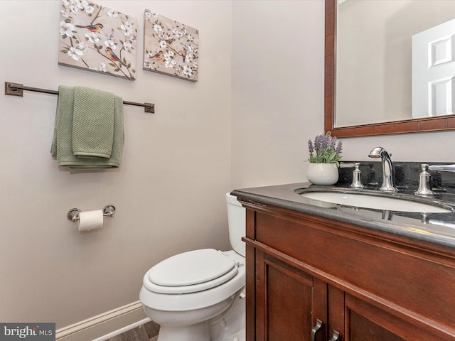 109 Rock Creek Ct, Frederick, MD 21702 - half bathroom featuring baseboards, toilet, and vanity